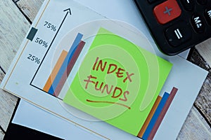 Concept of Index Funds write on sticky notes isolated on Wooden Table