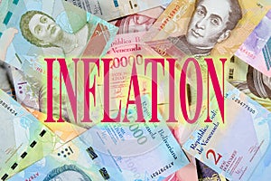 Concept of inflation in Venezuela. Bolivar paper money. Beautiful colorful bolivares close up background with title Inflation photo