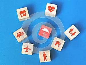 Concept of insurance coverage on wooden cubes.