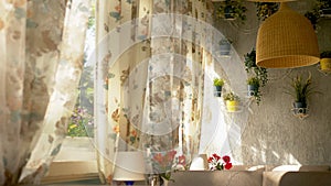 The concept of the interior windows. large full-length windows decorated with floral print curtains and house wall