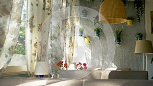 The concept of the interior windows. large full-length windows decorated with floral print curtains and house wall