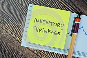 Concept of Inventory shrinkage write on sticky notes isolated on Wooden Table