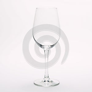 Isolated front view of an empty wine glass on white backdrop