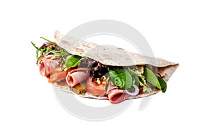 The concept of Italian cuisine. Piadina with ham, tomatoes, lettuce mix, pistachios and cucumbers on white background. Isolate