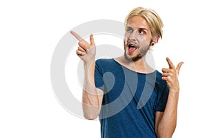 Young man laughing pointing with fingers