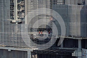 Concept of laborers working on modern construction site