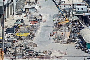 Concept of laborers working on modern construction site