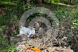 The concept of landfills  piles of garbage  landfills in nature  barbaric attitude to the environment.