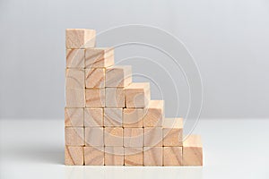 The concept of a large business corporation. Wooden blocks on a white background background
