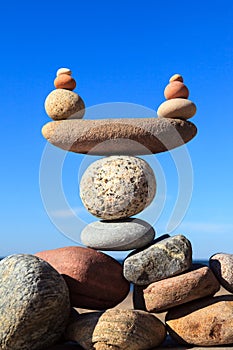 concept of life balance and harmony. Balance stones on the background of the blue sky