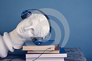 The concept of listening to an audiobook, literary podcast.