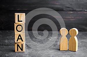 The concept of `Loan`. Businessmen are discussing questions about the company`s loans. The financial loans between the lender and photo