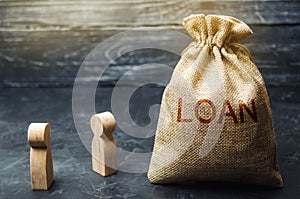 The concept of Loan. Businessmen are discussing questions about the company`s loans. The financial loans between the lender and