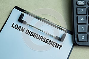 Concept of Loan Disbursement write on paperwork isolated on wooden background