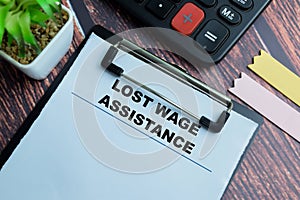 Concept of Lost Wage Assistance write on paperwork isolated on wooden background