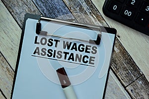 Concept of Lost Wages Assistance write on paperwork isolated on Wooden Table