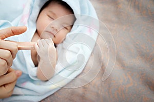 Concept of love and family relationship : close up newborn Asian