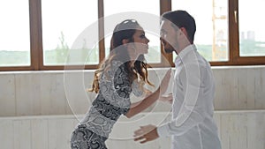 Concept of love, relationships and social dancing. Beauty young couple dancing social dance on white background
