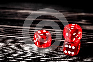 Concept luck - dice gambling on dark wooden background