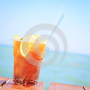 Concept of luxury tropical vacation. One Cuba Libre cocktail on