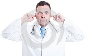 Concept of male medic or doctor making deaf gesture