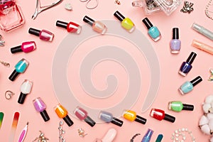 Concept, manicure with nail polish, pedicure on pink background, copy space
