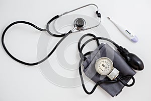 Concept for medicine. Different drugs and a stethoscope on a white isolated background. View from above