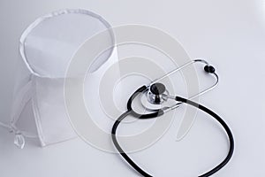 Concept for medicine. Medical items medical cap, tonometer, stethoscope on a white isolated background.