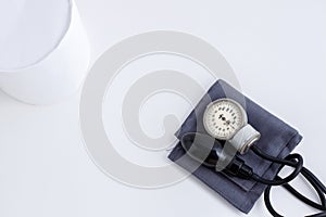 Concept for medicine. Medical items medical cap, tonometer, stethoscope on a white isolated background.