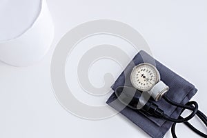 Concept for medicine. Medical items medical cap, tonometer, stethoscope on a white isolated background.