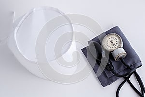 Concept for medicine. Medical items medical cap, tonometer, stethoscope on a white isolated background.