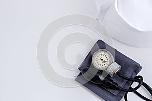 Concept for medicine. Medical items medical cap, tonometer, stethoscope on a white isolated background.