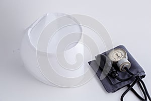 Concept for medicine. Medical items medical cap, tonometer, stethoscope on a white isolated background.