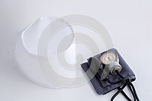 Concept for medicine. Medical items medical cap, tonometer, stethoscope on a white isolated background.