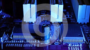 Concept of micro chips in blue backlight. Soft focus. Detail of microchips.