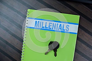 Concept of Millenials write on book isolated on Wooden Table photo