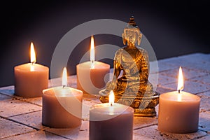 Concept of mindfulness and buddhism with Buddha and lighted candles
