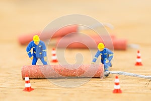 Concept miniature people working on Firecracker