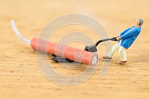 Concept miniature people working on Firecracker