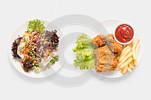 Concept of mock up fresh salad and Fried chicken and french fries set.