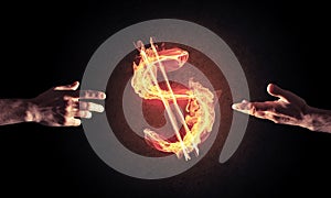 Concept of money making with dollar currency fire symbol on dark