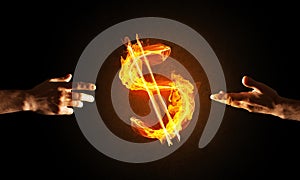 Concept of money making with dollar currency fire symbol on dark background