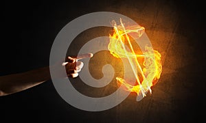 Concept of money making with dollar currency fire symbol on dark background