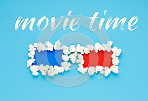 Concept of movie time with 3d glasses of popcorn.