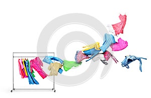 The concept of moving. Clothes fly off the hanger isolated on white background.