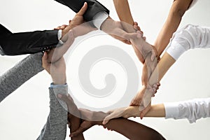 Concept of multiracial business people holding each others wrists.