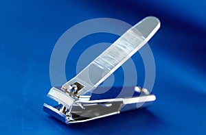 nail cutter on blue background