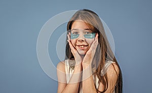 concept of natural beauty. healthy and tender skin. problem skin in adolescents. teen girl use eye patch. happy child