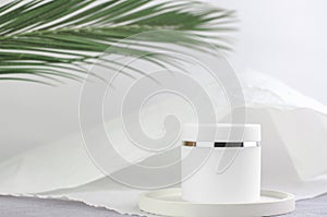 The concept of natural cosmetic products for spa treatments. Moisturizing cream white packaging mockup