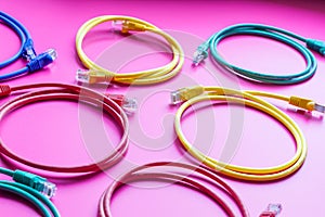 Concept network internet cable on pink background close up